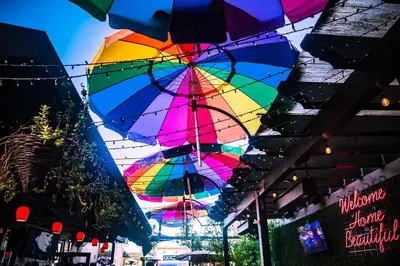 a group of colorful umbrellas hanging from a ceiling at Falcon Chic Escape - Hot Tub - Modern - Proximity in San Diego