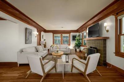 a living room with white furniture and a fireplace at Falcon Chic Escape - Hot Tub - Modern - Proximity in San Diego