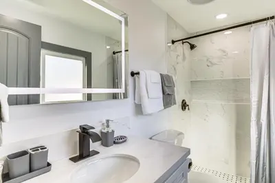 a white bathroom with a sink and a shower at Mission Valley Home 5 Mi to SDSU Campus in San Diego