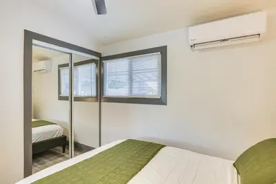 a bedroom with a bed and a window at Mission Valley Home 5 Mi to SDSU Campus in San Diego
