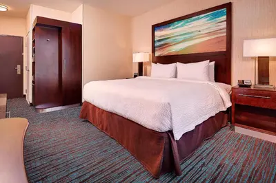 a bedroom with a large bed in a hotel room at Fairfield Inn & Suites by Marriott San Diego Carlsbad in Carlsbad