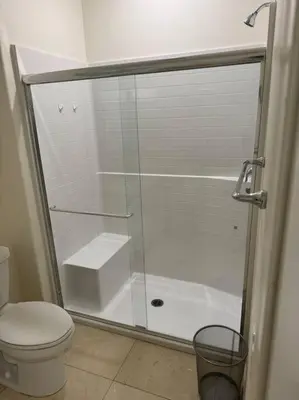 a bathroom with a shower and a toilet at Luxury 1200 sqft 1bdrm retreat with den in Menifee