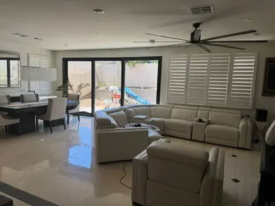 a living room with a couch and a dining room at A Tranquil Haven with Elegance in Menifee