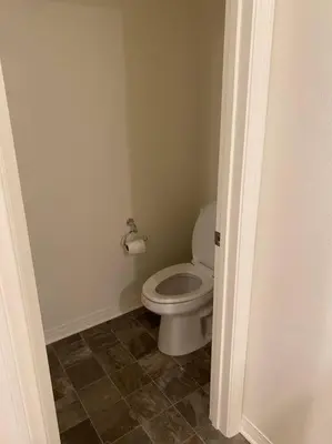 a bathroom with a white toilet in a room at A Tranquil Haven with Elegance in Menifee