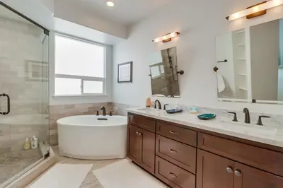 a bathroom with a tub and a sink and a shower at Rooftop Patio Hot Tub AC Beach & Bay Views in San Diego