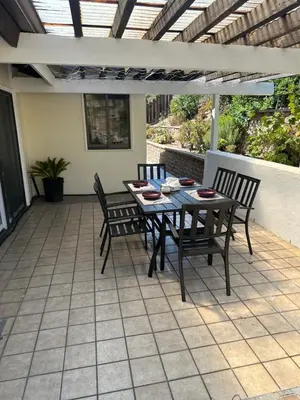 a patio with a table and chairs on a patio at Mount Helix Villa in El Cajon