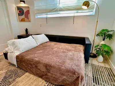 a bedroom with a bed in a room with a window at Casa Agave, 2 Bedroom, 1 Bath Guest House, with 3 Beds & Game Room in Vista