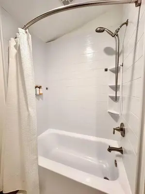 a white bathroom with a tub and a shower at Casa Agave, 2 Bedroom, 1 Bath Guest House, with 3 Beds & Game Room in Vista