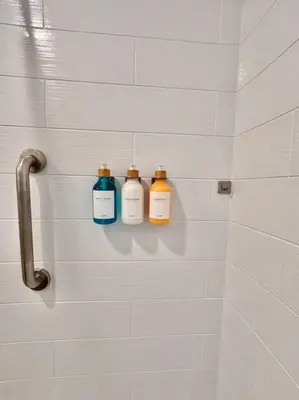 two bottles of soap sitting on a wall in a shower at Casa Agave, 2 Bedroom, 1 Bath Guest House, with 3 Beds & Game Room in Vista