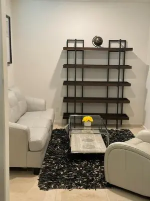 a living room with a couch and a coffee table at Elegant Retreat with Private Luxurious Gen Suite in Menifee