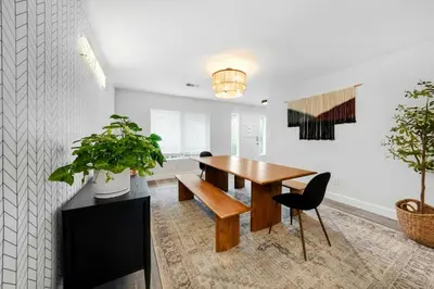 a dining room with a wooden table and chairs at Leucadia's Beach House w Game Room in Encinitas