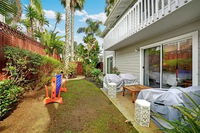 a house with a patio with a table and chairs at Leucadia's Beach House w Game Room in Encinitas