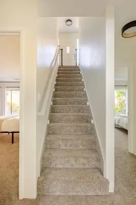 a stairway in a home with a staircase at Leucadia's Beach House w Game Room in Encinitas