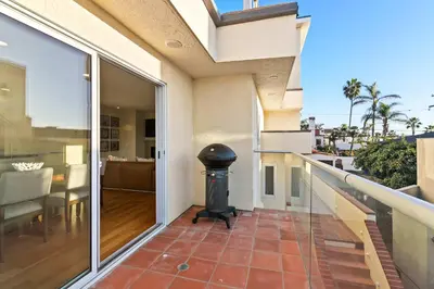 a balcony of a house with a trash can at Oceanview Townhome Just Steps from Iconic Windansea Beach in San Diego