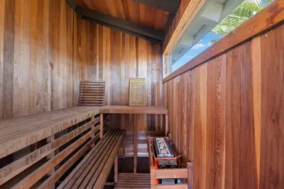 an empty sauna with wooden walls and a window at Above the Clouds 17acre Gated Hilltop Estate in Fallbrook