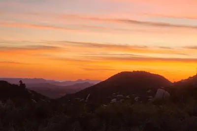 a view of a sunset from a mountain at Gentle and Cozy Comfort in an Off-Grid Retreat in Fallbrook