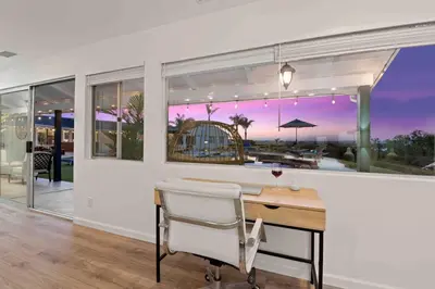 a dining room with a table and a view of the ocean at Immaculate 5BR Micro Resort with Heated Pool & Spa in San Diego