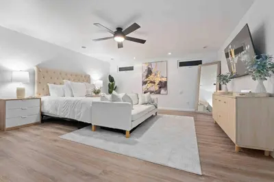 a bedroom with a bed and a ceiling fan at Immaculate 5BR Micro Resort with Heated Pool & Spa in San Diego
