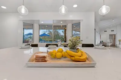 a table with bananas and other fruits on a cutting board at Immaculate 5BR Micro Resort with Heated Pool & Spa in San Diego