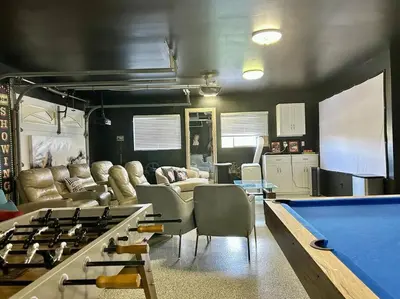 a living room with a pool table and a kitchen at Immaculate 5BR Micro Resort with Heated Pool & Spa in San Diego