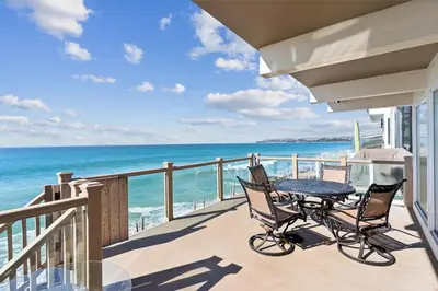 a balcony with a table and chairs and the ocean at Ocean View beach house Ocean View beach house-STR14-0105 & STR14-0133 in Dana Point