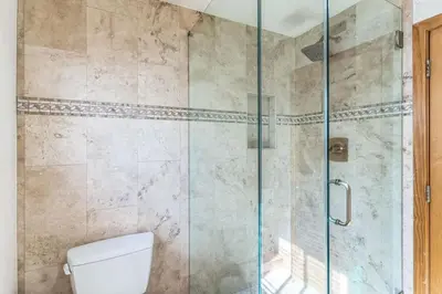 a bathroom with a toilet and a glass shower at Ocean View beach house Ocean View beach house-STR14-0105 & STR14-0133 in Dana Point