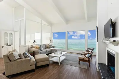 a living room with a couch and a fireplace at Ocean View beach house Ocean View beach house-STR14-0105 & STR14-0133 in Dana Point