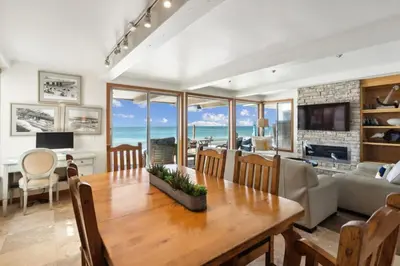 a dining room with a table and a living room with the ocean at Ocean View beach house Ocean View beach house-STR14-0105 & STR14-0133 in Dana Point