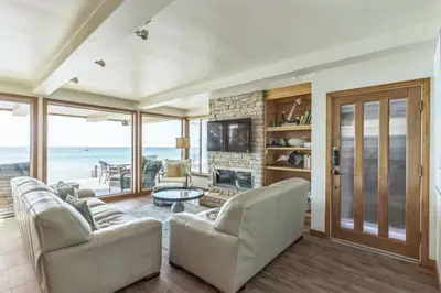 a living room with a couch and a television at Ocean View beach house Ocean View beach house-STR14-0105 & STR14-0133 in Dana Point