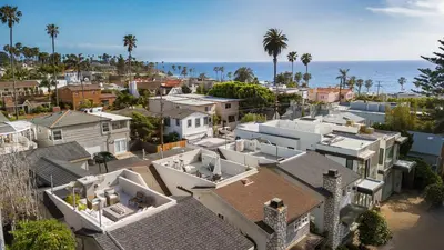 an aerial view of a city with houses and the ocean at Nantucket-Style - Steps to Beach Rooftop Deck Ocean Views in San Diego