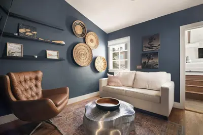 a living room with a couch and a chair at Nantucket-Style - Steps to Beach Rooftop Deck Ocean Views in San Diego