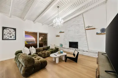 a living room with a couch and a table at # Marbella Lane - Home with Ocean & Golf Course Views in San Clemente