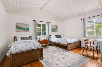 a bedroom with two beds and a table at The Porter House - Sweeping Ocean Views - La Jolla in San Diego