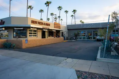 an empty parking lot in front of a store at Steps to Beach & Close to Restaurants and Shops in Oceanside