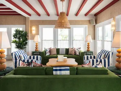 a living room with a green couch and chairs at Le Petit Pali Laguna Beach in Laguna Beach
