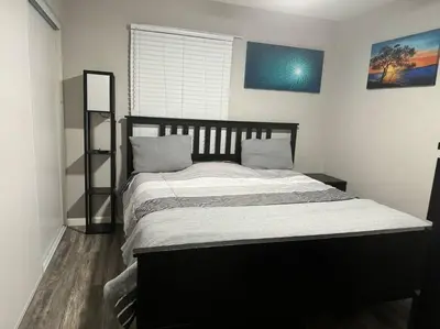 a bedroom with a large bed in a room at Home away from Home in San Diego