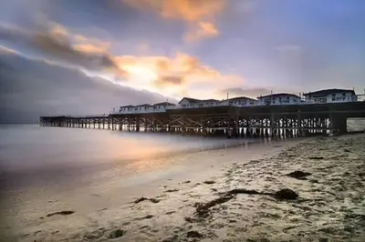 a pier on the beach with houses on it at Majestic Lux Home with Heated Pool and Spa! in San Diego