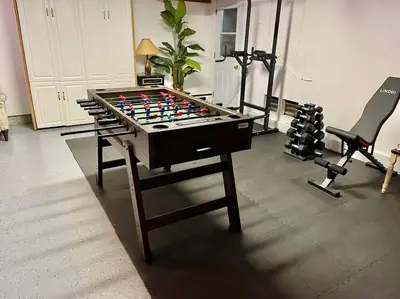 a room with a foosball table and a treadmill at Majestic Views Pool&Jacuzzi, Mini Golf, Playground in Spring Valley