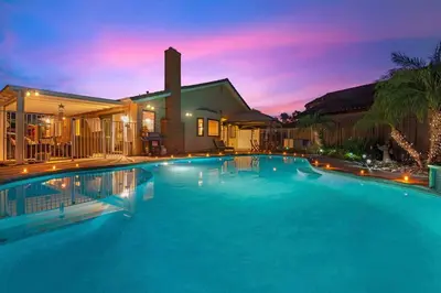 a large swimming pool in front of a house at Majestic Views Pool&Jacuzzi, Mini Golf, Playground in Spring Valley