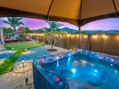 a hot tub in the backyard of a house at Majestic Views Pool&Jacuzzi, Mini Golf, Playground in Spring Valley