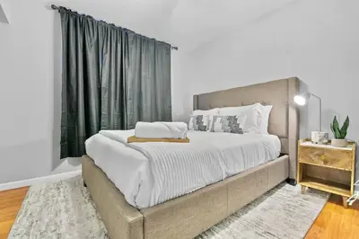 a bedroom with a large bed and a window at Massive 5BR Resort Style Retreat with Heated Pool in San Diego