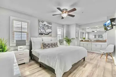 a bedroom with a bed and a ceiling fan at MB Contemporary 14 Guests by Sand AC plus Garage in San Diego