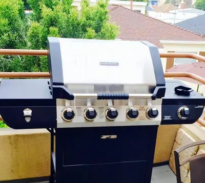 a blue and white grill sitting on a patio at MB Contemporary 14 Guests by Sand AC plus Garage in San Diego