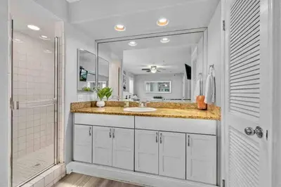 a white bathroom with a sink and a shower at MB Contemporary 14 Guests by Sand AC plus Garage in San Diego