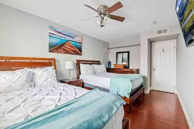 a bedroom with two beds and a ceiling fan at MB Contemporary 14 Guests by Sand AC plus Garage in San Diego