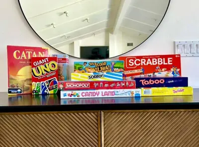 a pile of snacks on a counter in front of a mirror at 1 Block to Sand Stylish Boho Retreat in San Diego