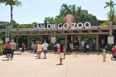 a group of people standing outside of a santa claus zoo at 1 Block to the Sand Stylish & Spacious Studio! in San Diego