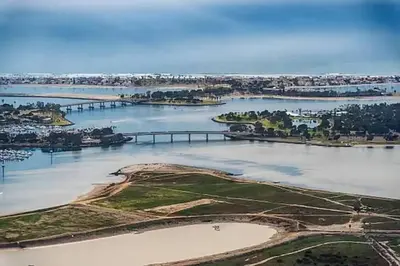 an aerial view of a river with a bridge at 1 Block to the Sand Stylish & Spacious Studio! in San Diego