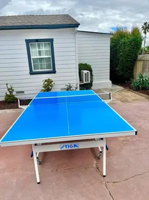 a blue ping pong table in front of a house at PB 3BR Beach Retreat Hot Tub Mini Golf in San Diego