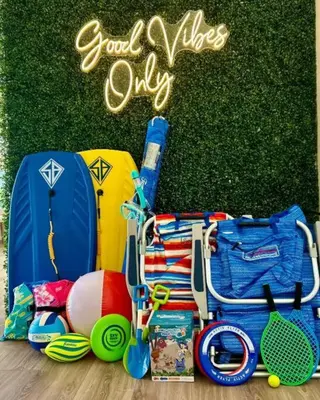 a bunch of items that are sitting on the grass at PB 1BR BOHO with Parking, AC, and Large Patio in San Diego